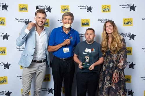 four people stood in front of National Cat Awards backdrop