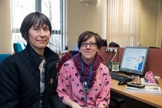 two women with short brown hair