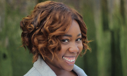 Actress Chizzy Akudolu smiling at camera