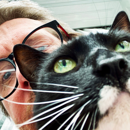 black and white cat and man selfie