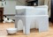 A grey plastic cat bed and hide.